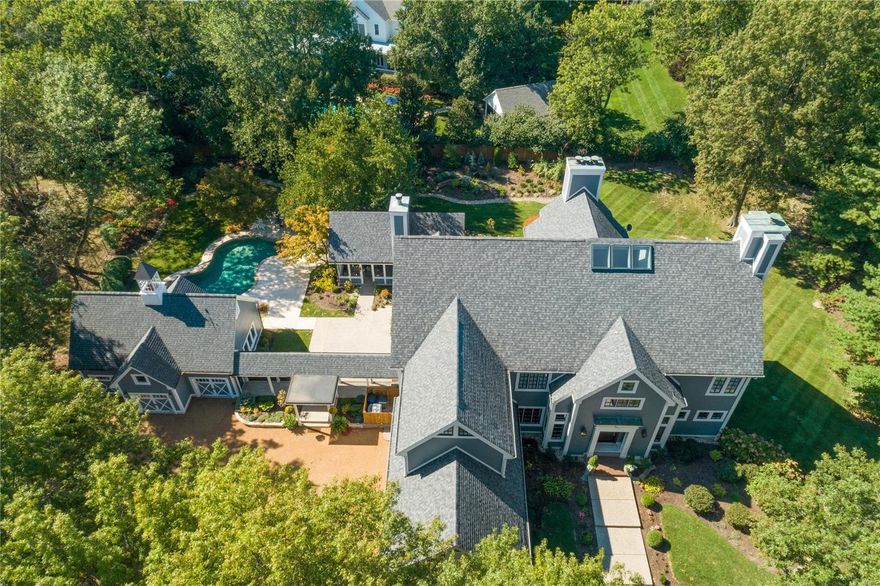 Entertainer’s Dream Home in Private Park-like Setting. If you love the flow of an open concept home where every room seamlessly connects, ceilings that soar from 10 to 30 feet, the beauty of outdoor living spaces that can be seen from countless windows & high-end renovations found in every corner, you’ve found your next home on 2+ acres in the heart of Ladue. Courtyard patios feature an outdoor kitchen, gazebo and gas-lit fire pit leading to a resurfaced pool deck & pool. Fully renovated kitchen and hearth room with Wolf & Sub-Zero appliances, marble countertops and an oak beamed ceiling. Three-story great room with full length windows complemented by a 30-foot dry stack fireplace. Dining room with custom coffered ceiling. Sunken living room with fireplace & wet bar. Huge master bedroom suite with vaulted ceiling and 2 walk in closets. LL with custom 2,500 bottle wine cellar, full kitchen, workout room & bedroom/bathroom suite, family room, fireplace & pool table nook. Six-car garage. Additional Rooms: Mud Room, Wine Cellar