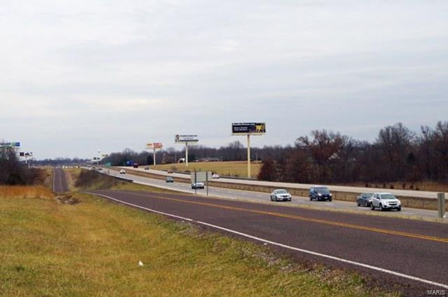 Located on I-70 near Jonesburg, MO is this 142 acre rolling farm. The property features 46 acres wooded with 96 acres tillable. This high visible property sits on the ridge overlooking I-70 giving it excellent potential for current or future development. This combination property has excellent income and hunting with development potential, only one-half mile on the service road from the I-70 overpass at Jonesburg, MO. 

Asking Price REDUCED: $986,000 /$6,950 per acre