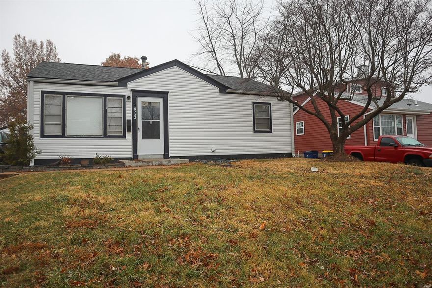 Don't miss out on this great opportunity in St. Ann! Inside, the open layout of the main living area is perfect for entertaining, with the living room flowing into the bright kitchen with a tile backsplash. Updates include new flooring, paint, and siding. Three bedrooms, an updated bathroom with tile-surround shower, and utility room complete the space. A screened patio leads to the fenced backyard and detached 1-car garage for storage. In a great location, within walking distance of schools and parks, this renovated home is just waiting for its new owners! Seller prefers an as-is offer.