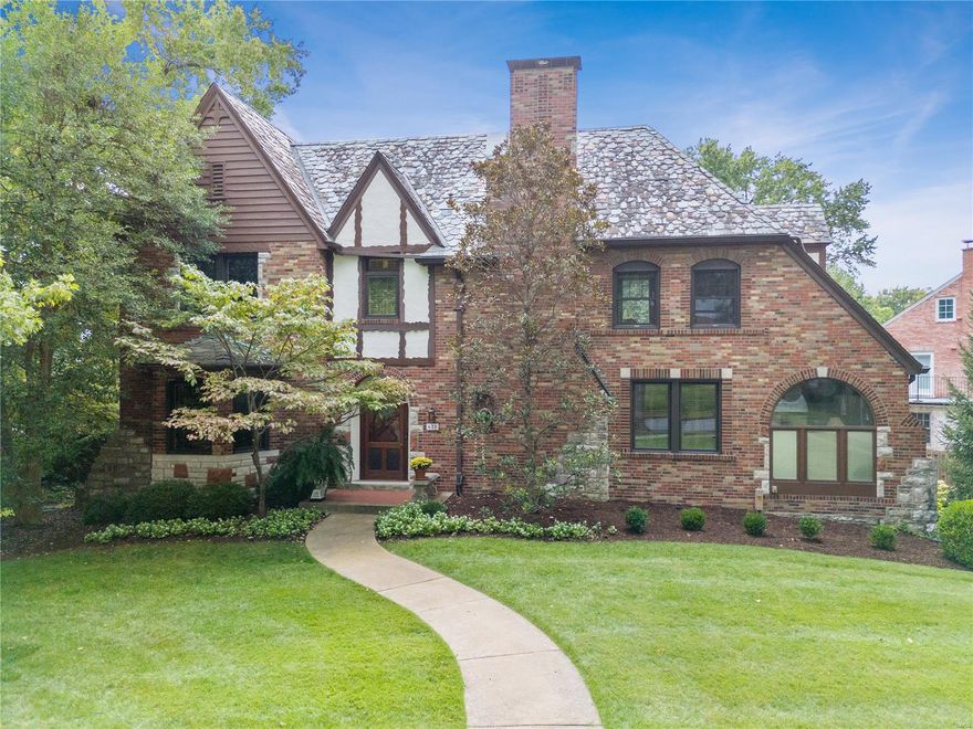 This absolutely Picture-Perfect Tudor style home is magnificent inside and out. Situated in the tree-lined Moorlands subdivision of Clayton, this home is a beautiful combination of old-world craftsmanship with many modern amenities. Features include wood floors, crown molding, bay windows, leaded stained glass window and spacious rooms throughout. Inviting Living Room with built-in cabinet, fireplace with marble surround and French doors opening to a light-filled Sunroom, formal Dining Room with built-in storage, updated Chef's kitchen and breakfast room, Main Level Laundry, large Family Room addition with built-in bookcases, fireplace & bar ,opening to a fabulous Screened Porch. The Second Level offers an extra large Primary suite with walk-in closet and additional closet for shoes, handsome updated bath. Three additional bedrooms and newer hall bath. Three car attached garage, some newer windows, LL office & half bath. Walking community near shops, parks and restaurants.  A must see!