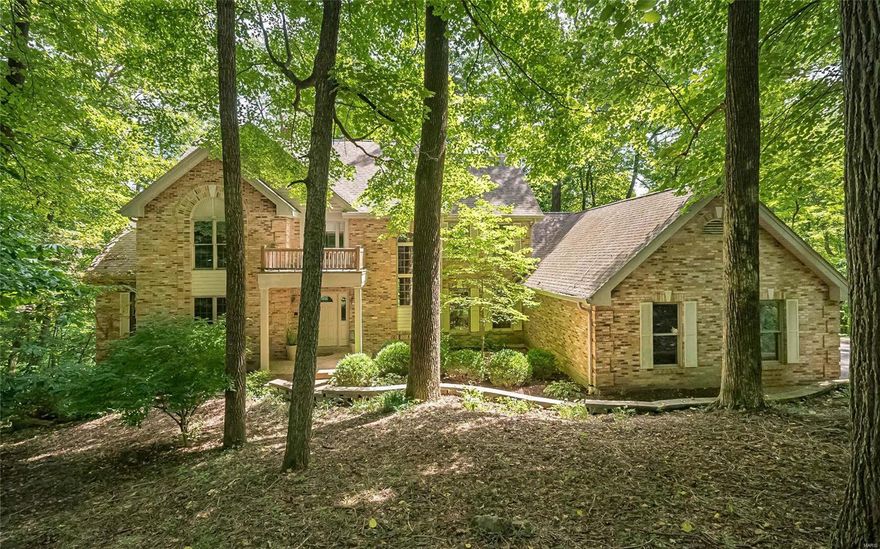 Nestled among the trees off a rustic lane is a home that welcomes you to a life where city noise becomes a memory! Serene 3 acre private world just minutes from Chesterfield Valley! With 5000+ finished sf, this Hardesty built 1.5sty atrium features 4+BRs, 4.5baths, 2 story great rm, 3 f/p, crown moulding, intimate & formal dining areas, library, main flr master suite w/ balcony, hearth rm, main flr laundry, fin LL w/ possible 5th BR, multi-level composite decks, oversized 3 car gar & the list goes on! Remodeled kitchen boasts quartz counters, plethora of custom cabs, tile backsplash, new lighting & it all glitters when complemented by glowing wood floor & wooded views that flow past the brkfst rm to the vaulted hearth rm. Updated master bath offers a dazzling spa-like design! Ensuite & 2BRs sharing J&J bath upstairs. Wet bar & rec rm in LL. Zoned HVAC. Central Vac. Security Sys. Rockwood Schools. Spilling with value! Take advantage of today's low rates to call this your forever home!