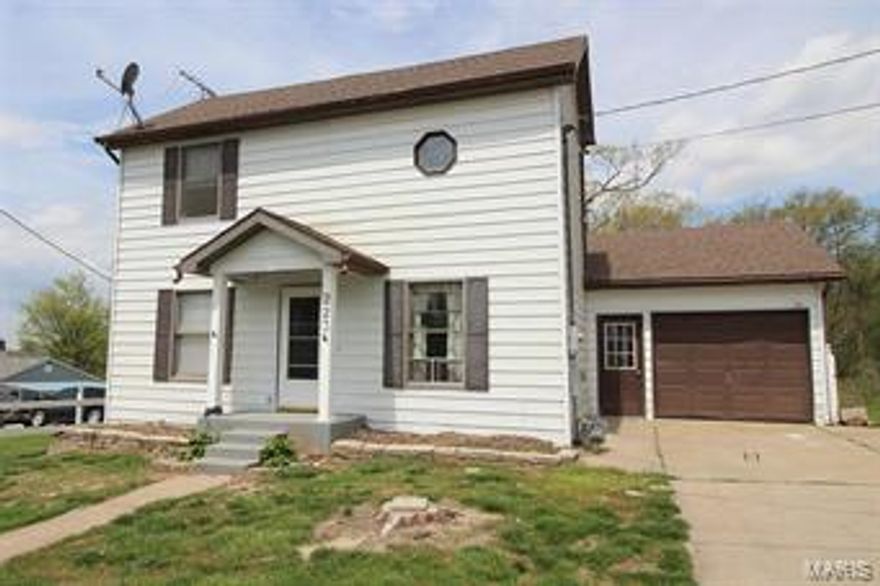 Nestled on a large wooded lot, your future home awaits.  Upon Entering you will fall in love with the 2 story great room featuring wood laminate flooring.  The kitchen features wood cabinetry, smooth top electric range, built-in microwave, dishwasher, and disposal.  Main floor bedroom features laminate flooring.  The main floor features a half bath and laundry.  Ascend the open staircase to 2 additional bedrooms and a full bath.  Need more space? Relax outside on your covered patio and entertain in the large backyard.  Additional Features: Roof (2015) Furnace (2017) A/C (2011) Water Heater (2013). Bring your finishing touches and make this one of a kind home yours today!  Property Sold in As-Is condition.