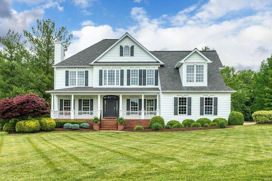 Classic 2-sty Southern Colonial in prestigious Camelot. This custom-built home features well-proportioned rooms with oak hardwoods, detailed trim work & full-height windows that draw in an abundance of natural light. Wide covered porch entrance highlighted by architectural columns leads to impressive 2-sty foyer, living room with marble fireplace, formal dining room, spectacular great room with tiled fireplace & granite bar and study with private entrance. Chef’s kitchen with 42” cherry cabinetry, premium appliances & breakfast bar adjoins light-filled breakfast room with wide bay window. Spacious master bedroom suite with vaulted sitting area & luxury bath with jetted tub provides an appealing retreat. 3 Additional bedrooms, 1 with ensuite bath & 2 with Jack n’ Jill bath, & convenient laundry complete the 2nd floor living quarters. French doors open to patio with stone fireplace, pavilion with outdoor kitchen and resort style pool with waterfall wall surrounded by landscaped gardens.