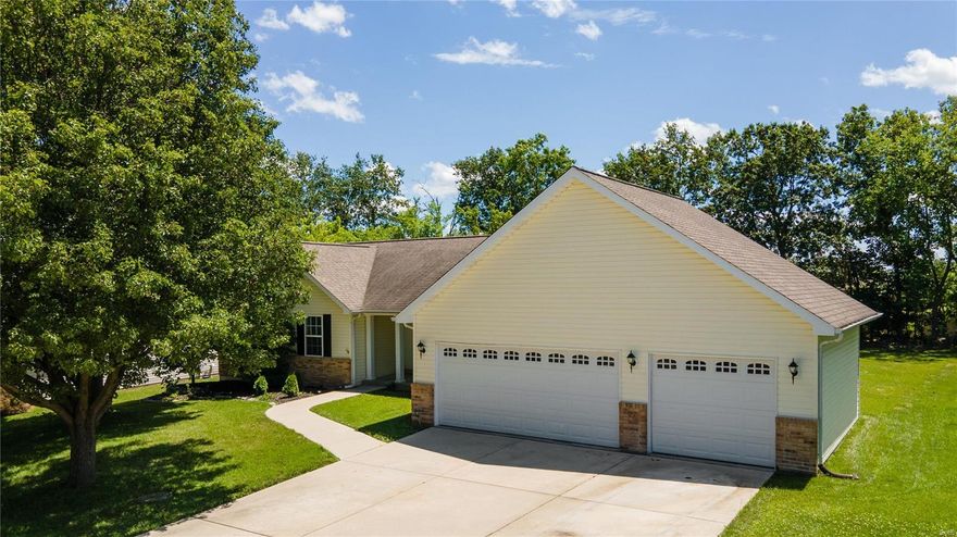Welcome home to this charming 3 bed 2 bath ranch in O'Fallon! The large open floor plan boasts updated LVP flooring and paint throughout the home and into the kitchen with quartz countertops, a large island, and stainless steel appliances. Large family room with vaulted ceilings, wood burning fireplace, and skylights. The primary bedroom with tray ceiling is spacious and comfortable, with plenty of natural light and walk in closet. Adjacent is the large primary bathroom with double sinks, separate tub, and shower. The other two bedrooms are also well-sized and ideal for a home office or guest room. Large, flat backyard backing to trees and a 3 car garage! Huge unfinished basement ready for your customization.