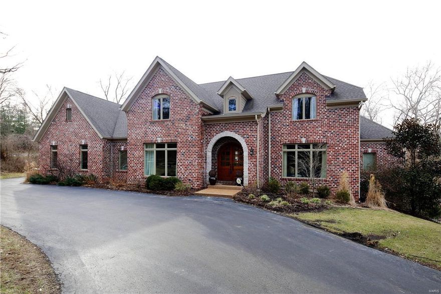 7 Year Rehnquist built home in Ladue offers Great Value in a Beautiful area. Abundant architectural features include barrel vault and tray ceilings, arched doorways, extensive millwork and moldings.  The rooms are spacious, light filled and work well for both entertaining and family living. The main floor includes an office off the foyer, living room with fireplace, dining room linked by a butlers pantry to the kitchen, hearth room and fabulous main floor master suite.  The chefs kitchen offers granite counters, center island, 2 dishwashers, 2 ovens, a built in microwave and 6 burner gas stove. The master suite boasts his and her walk-in closets, large bathroom with his and her vanities, separate whirlpool and over sized steam shower. Upstairs, 3 bedroom suites with their own bathrooms and walk in closets. An unfinished basement walks out to the patio and fenced yard with plenty of room for a pool.    The park like yard extends past the creek into the woods for complete privacy. Additional Rooms: Mud Room