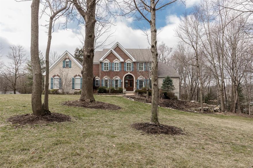 Cross over the bridge to your own paradise in Sugar Creek. Close to downtown Kirkwood while feeling like your own personal resort with over 5,800 sq ft of total liveable area. 1.26 acre lot with mature trees, extensive landscaping, covered porch with full kitchen (including 2 burners) and built-in heaters to enjoy the special setting year-round. Three outdoor areas to relax or entertain, including a hot tub and pond with waterfall with flagstone patio. This beautiful 5 bdrm home has his and her closets in the main-floor master bdrm with large, updated master bthrm. Finished walkout basement with wet bar, beverage refrigerator, beer tap, fireplace, full bathroom, theater room and large area for relaxing or entertaining friends and family. Adjoining finished, 3 car garage. Too many updates to detail, but all bathrooms and kitchen are updated. Newer mahogany front door and staircase, and professionally installed sprinkler system and landscape lighting. A once-in-a-lifetime home.