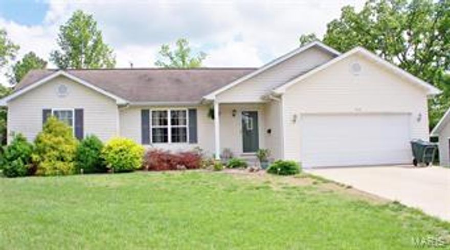 What a jewel! Move in ready. Beautiful new flooring installed 1 yr. ago in living, dining and master bedroom.  Open living floor plan with vaulted ceiling and accent shelves. Separate bedroom plan.  The deck in back is huge, freshly stained and awesome. Amish built utility shed stays. Quite neighborhood. A must see.