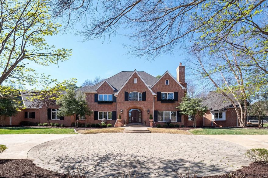 A truly Timeless & Elegant Residence nestled in prestigious Huntleigh Woods. This Magnificent home boasts 6 bedrms, 7.5 baths on a gorgeous sprawling lot. Step into the Grand 2-story foyer, and be captivated by the open flr plan, w/a main flr primary suite & 4 add'l en-suites on the second flr. The main level features a Great rm & sophisticated Bar area, perfect for entertaining. Hardwood flrs grace the living spaces, complemented by high ceilings & an abundance of natural light.The updated kitchen/hearth rm flow seamlessly to the covered porch. Main flr laundry rm & 2 expansive locker rms for ample storage. Primary suite offers 2 custom closets & luxury bath.The High Pour lower level presents a vast family room, full bath, guest rm, & exercise rm, along w/ generous storage space. Tennis court & a 4-car oversized garage.This private & stately retreat offers an unparalleled lifestyle of Luxury & Tranquility. Seize this rare opportunity to own a Sophisticated Residence. Additional Rooms: Mud Room, Wine Cellar