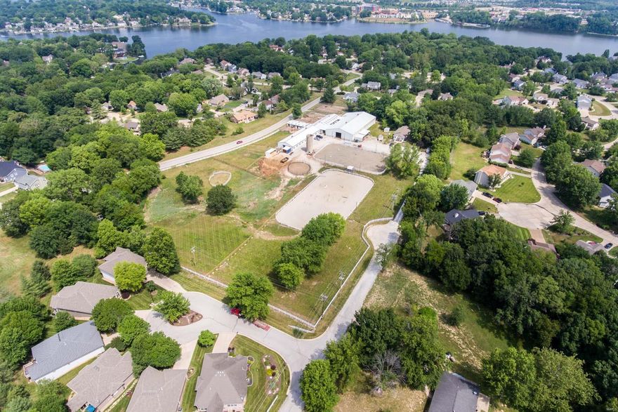 Rare development opportunity in the heart of Lake St. Louis.  Zoned R-2 single family with 8 +/- gently rolling acres.  This property is bordered by Fox Trail Drive on the west & N. Henke Road on the East and surrounded by single family homes.  Currently used as an equestrian facility and new owner may continue current use per Lake St. Louis.  Three connected barns offer 35 stalls including 10 oversized box stalls w/private turn-outs, grooming stalls & 2 tack rooms.  A large 65 x 165 indoor arena features 2 large bay doors, improved riding & an airconditioned viewing room.  Additionally there are 2 outdoor arenas, a caretaker’s house and additional outbuildings.  Most of the acreage is fenced and cleared.  In person viewing of property by Appointment Only.