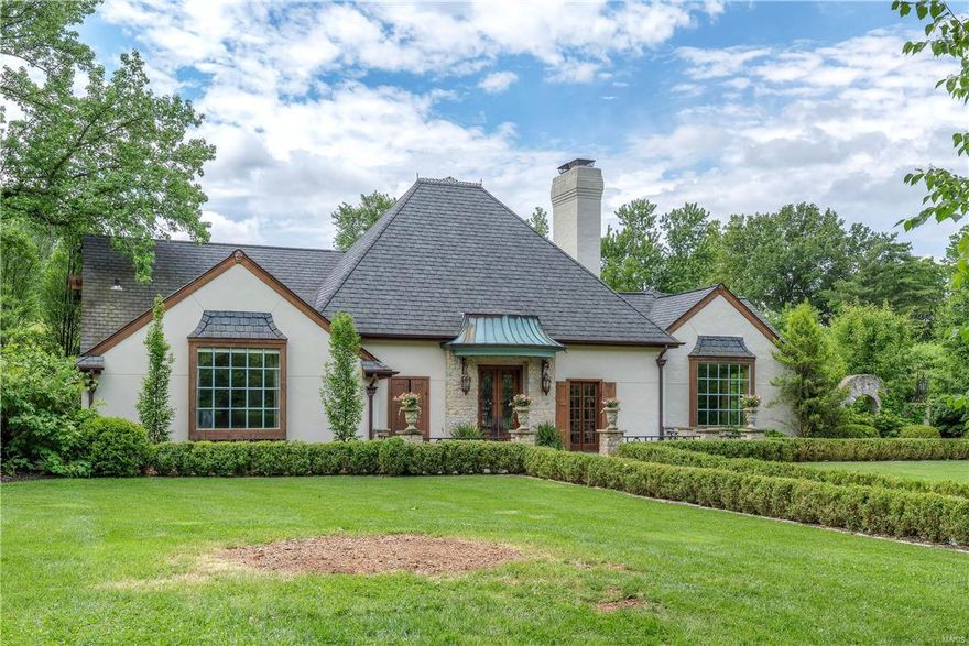Magnificent 1.5sty French Manse on gorgeous 1+ acre. Step through the slate terrace into the 12' limestone entry foyer flanked by 18th c  armoires to the stunning living & dining rooms. Fabulous state-of-the-art kitchen w/huge granite island, copper sinks, Italian ceramic counter & stone floor adjoins vaulted hearth room w/stone fireplace & glazed walls. Sumptuous main floor master suite w/beamed cathedral ceiling, beautifully appointed bath & dressing room w/mirrored closet doors from Ritz-Carlton Chicago. Dramatic curved staircase to 2nd floor w/2 additional bedroom suites plus bonus loft area with 2nd floor laundry. Limestone rear staircase accesses the large carriage house apartment w/family room, wet bar, 2 large bedrooms & full bath. Finished lower level includes huge rec room, 6th bedroom, full bath, laundry & customized closets. Gated entry to incredible grounds that feature pergola, stone fireplace, pool, hot tub, outdoor kitchen, private walkways with fountain & 3-car gar.