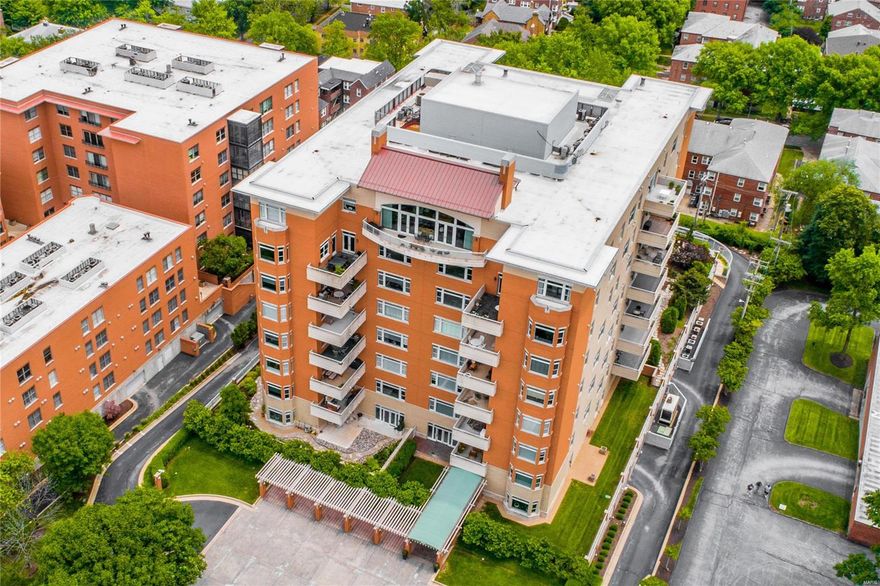 This elegant townhouse condo is in one of the finest full-service buildings in Clayton. The property was completed for the owners by combining the 4th and 5th floor units into one 2-level unit. Private, interior elevator in the unit. The design makes great use of the space, providing a nice flow on the 1st floor for entertaining, while giving privacy to the 2 well separated bedrooms upstairs. Neutral white kitchen with a center island & adjacent wet bar opens a family room. Off of the dining room is 1000-bottle wine room. The living room has a gas fireplace & an expanse of windows and door to a large terrace. The 2nd floor has a 2 bedroom suites & a laundry room. The master suite includes a bathroom with double sinks, separate shower & an air-driven jacuzzi tub, expansive master closet & a 2nd terrace. 3 garage spaces and 2 storage lockers. Building amenities include: 24-hour doorman, heated pool, exercise room, party room & 3 guest suites. Location: City