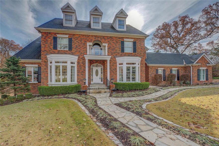 Drive into this three home cul de sac and prepare to be "WOWED" by this stately, brick, 1 and 1/2 story on a park like acre. A stunning two story entry, dramatic curved staircase, and marble floors set the tone for an elegant, but comfortable family home. Gourmet kitchen has cherry cabinets, tasteful stained glass window, breakfast area, wet bar, hearth room with gas fireplace and built ins. Master bedroom has ample closet space and light, airy 3 season room. Great room features fireplace, double french doors leading to a spacious deck with Brazilian wood floor. Upstairs features 3 generous sized bedrooms with Jack and Jill bath or ensuite bath, loft overlooking foyer and great room and a multipurpose room which could be a 5th bedroom, play room or media room. Walk out lower level is perfect for game room or child's play area. Adults will like it, too! Too many exciting features to name here, so make an appointment today to see for yourself!