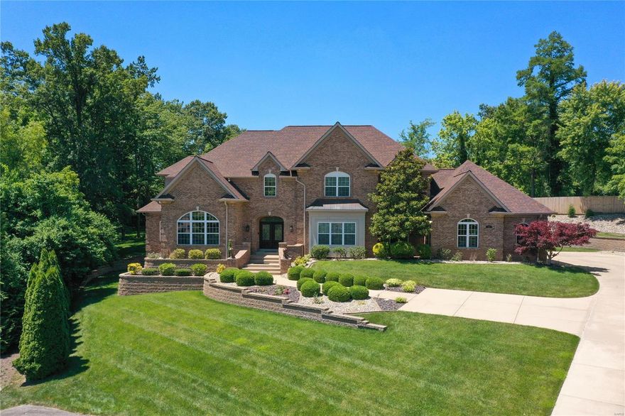 Luxury & comfort prevail in this all-brick 1.5-story home on a 3/4 acre lot with 6 beds, 5 full baths, 2 half baths & a 4-car oversized garage. The interior boasts custom wood details, including all wood closet organizers, fireplace surrounds, and kitchen cabinetry. The main level includes a spacious primary suite w/ two walk-in closets, formal living and dining rooms with custom millwork and imported Egyptian crystal chandeliers, a large great room with a gas fireplace, & a family room off the eat-in kitchen. This home was designed w/ storage in mind. It features two large back hall closets & built-in cubbies. This accessible home includes an elevator & a handicap-accessible en-suite bathroom in one of the spacious upstairs bedrooms. The walk-out lower level offers ample storage, a wet bar, a media room, & the 6th bedroom with a full bath. Outside, the property includes a pool, perfect for relaxation & entertainment. 4 Zones HVAC, in-ground sprinkler system and partial home generator. Some Accessible Features