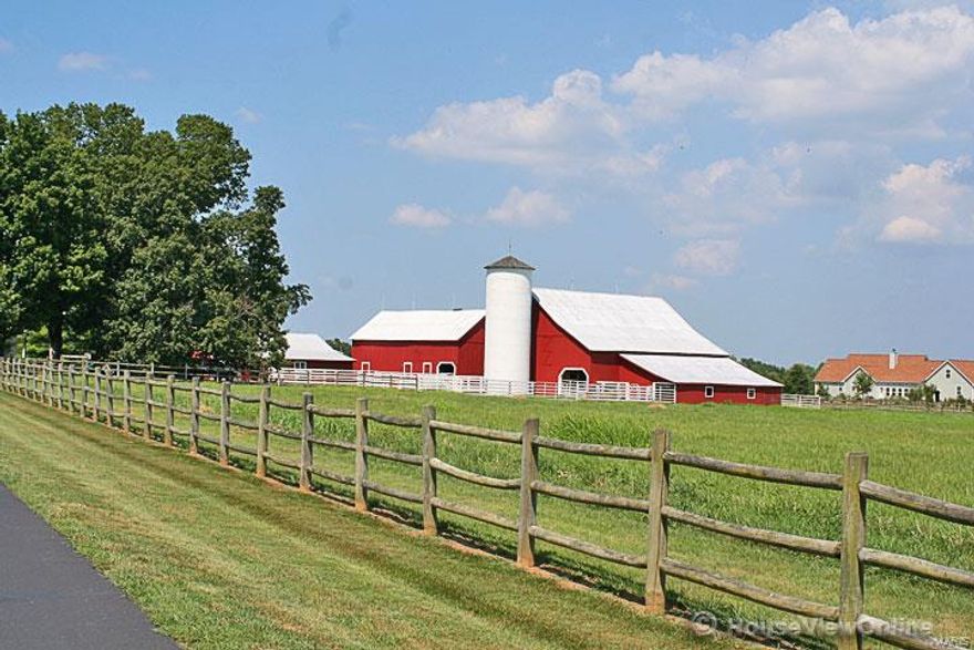 What an AMAZING opportunity!! HORSE LOVERS dream!!!  Fantastic, completely remodeled 111 year old farmhouse. This exclusive home sits on 21.5 beautiful acres m/l just outside Farmington and features 4+ bedrooms & 5 baths.   The entire home has been remodeled from the kitchen & baths to the stunning family room, to the wrap around porch to the attached garage with studio apartment above garage. Newer roof and windows. Home also features Two 2-Car garages, 3 functioning barns & silo.  Don't miss the guest quarters above the attached 2-car garage. OUTSIDE THE CITY LIMITS!