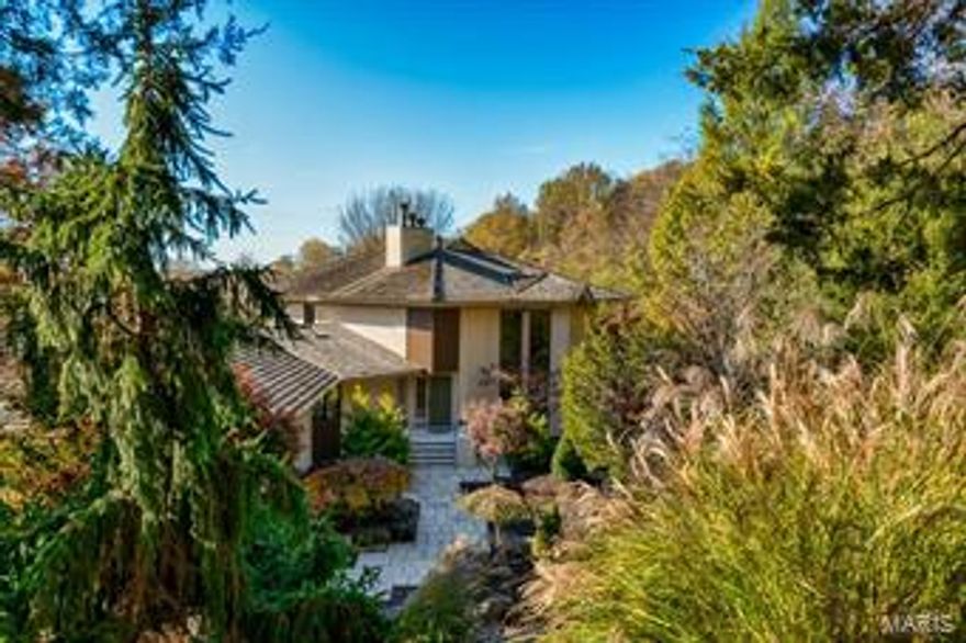 You will love this dramatic, contemporary home located in Wildwood just minutes from Chesterfield Valley. The home is over 5,000 sf. It is open, spacious & bright. You will appreciate the private setting with views of the rolling hills of Chesterfield. Windows span the south-facing back of the home that look over a stunning pool area with an infinity edge, fire pit and the forest beyond. The Living Room and Dining Room open to each other and are the ideal setting for elegant or casual entertaining. The designer kitchen features granite counters, high-end appliances, huge walk-in pantry, large breakfast room and opens to a Hearth Room with a fireplace. The master bedroom suite is separate from the rest of the living area to give you privacy. The master bath is luxurious and the walk-in closet is huge! The LL features a walk-out to the pool area, sunroom, recreation room with a wet bar and two bedrooms with adjoining, private bathrooms. Many decks and patios. 3-car garage. 2.15 acres. Additional Rooms: Sun Room