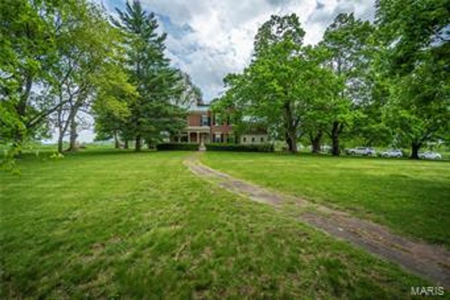 289 Acre Farm in Gorgeous Rolling Hills of Clarksville. Stately, historic, 2 story brick home with copper roof, gutters & downspouts sits among century old hardwoods, flowering shrubs & has an iron fenced backyard with a lovely fruit orchard. 2 fireplaces, 6 bedrooms & 4 baths provide plenty of room. Throughout the home are 12 foot ceilings & original wide pine floors in excellent condition. Country kitchen features butler’s pantry & French ceramic countertops. Separate dining room w/wood burning fireplace offers an elegant ambiance. Updated electrical & other systems. Classic, 3 story, wood barn w/12 stalls, paddocks, storage areas & huge hayloft is ready for your horses. Plus huge, metal storage barn w/concrete floor. Pastureland is fenced & cross-fenced. Another interesting feature is the observatory beyond the backyard. A piece of history awaits you with great deer & turkey hunting accessed by drivable trails throughout the woods. Outstanding views from all areas of the farm.