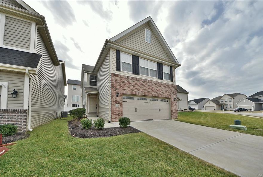 Fort Zumwalt School District! You will instantly adore this 4 bedroom/3.5 bath brick-front detached townhouse from the moment you pull up! The inviting open floorplan greets you w/ updated wood floors that flow naturally into the main living spaces of the dining room, adjacent living room w/ bay-set atrium walk-out, & an oversized eat-in kitchen w/ a large pass-through to the living room. Also note the ultra-convenient main floor laundry w/large closet & powder room. The upper level features a central sitting room leading to the massive master suite featuring double door entry, a deep coffered ceiling, walk-in closet & private full bath w/ a lounging tub & walk-in shower. 3 additional spacious bedrooms included on upper level. The finished lower level adds to your functional living space w/ new wood floors '17, a huge family room w/ egress window & 3rd full bath. Coming home is a breeze w/the attached 2-car garage & additional off-street parking. Spnklr Stysm. Schedule a showing TODAY! Location: Detached