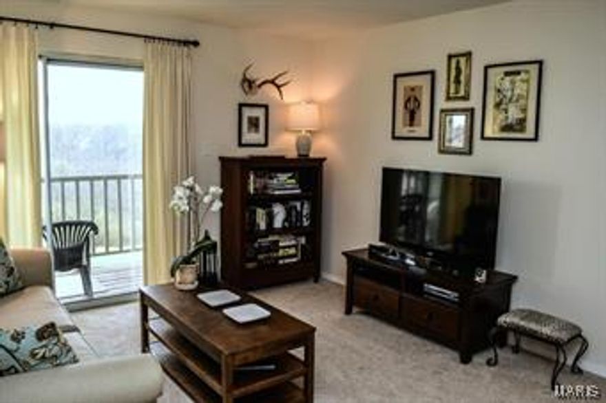 This condo is ready to move right in. Brand new carpet in living room & bedrooms. The eat in kitchen has a nice size pantry, tile floor, and plenty of counter space. Sliding doors to the balcony make the space light and bright with a great view of the woods from your private balcony.  Washer & dryer are located in the condo along with your own storage area. Many updates have been done to this unit including  a brand new furnace. Covered parking is provided, the complex includes pool & clubhouse.  Convenient Ballwin location it is just minutes to 141, highways and shopping. Monthly fee includes water, sewer, trash, ground & exterior maintenance. Why rent? When you could own this condo it is FHA approved. Location: End Unit, Upper Level
