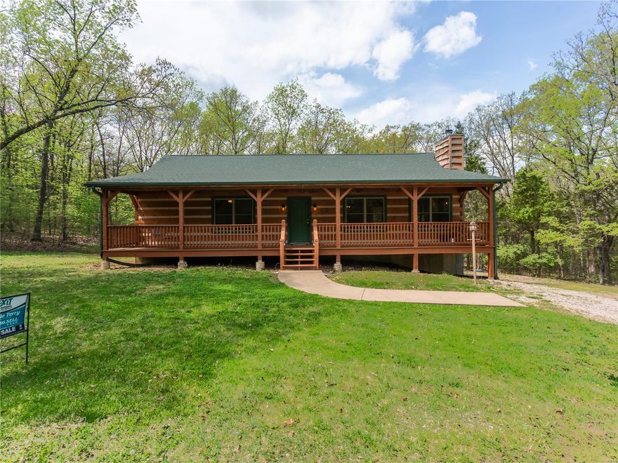 Don't miss out on this true Appalachian Hand-Hewn log home.    Walk in to an open floor plan with vaulted ceiling and, wood burning fireplace with quadra-fire insert, large breakfast bar and updated kitchen.  Spacious rooms both with walk-in closets.  Enjoy those gorgeous days on the 50x10 screened in porch on the back which is backing to trees.  Partially fenced yard and additional lot to enjoy the privacy.  The lower level is just waiting to be finished offering a walk-out and rough bath.  Come enjoy swimming at the beach or boating.  Seller is offering a home warranty and first year paid assessments.   This is a must see!