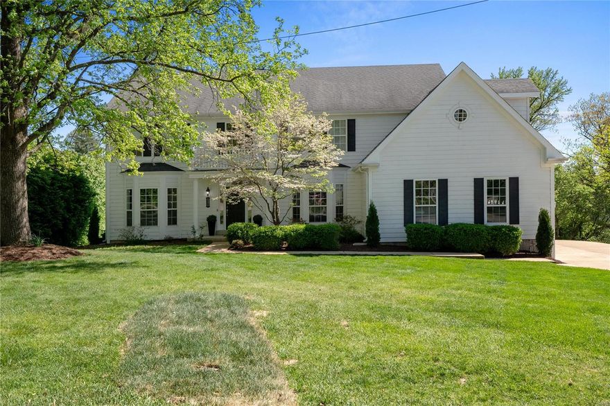 Spacious 2-story home w/ over 4800 sqft of total living space in a cul-de-sac in desirable Ladue School district, offering comfort, modern amenities, & many updates. Enter the bright 2-story entryway leading to a dining room w/ custom built-in cabinets, a wet bar w/ refrigerator drawers, ice maker, lots of storage, & an office/living room. The family room has a gas FP open to a dining area that can accommodate a large table & the kitchen w/ white cabinets, a center island gas cooktop, & granite counters. Neutral paint color throughout, 9’ ceilings. New beautiful flooring on main level. 5 bedrooms on the 2nd floor, primary bedroom w/ custom built-in cabinetry, en suite bath & walk-in closet. Additional 4 bedrooms w/ Jack N Jill Baths. Entertain on the large deck off the FR & kitchen w/ remote-controlled awning. Perfect for entertaining. Beautiful curb appeal. The walk-out LL features a family/rec area, full bath, a bedroom w/ an egress window & storage, Close to Hwys, Hospitals & Dining