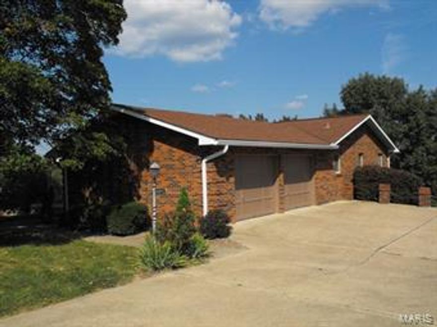 Perched high on a ridge and not far from Stone Hill Winery, this beautiful all-brick, 3 bedroom home offers scenic views overlooking Historic Hermann Missouri from it's full length deck and lower patio. Inside on the main level you will find 2 bedrooms, one being a master bedroom suite, 2 1/2 baths, a large kitchen complete with built-in appliances, a large family room with a full masonry fireplace, and outside access to the deck. On the lower level you will find an additional bedroom and full bath, a second all masonry fireplace, a large rec room/family room, a wet bar, and a large workshop/hobby area. This home has it all with cedar lined closets (some walk-in), Anderson windows, an oversized two car garage, and all appliances are included. One look and you'll want to call it home.
