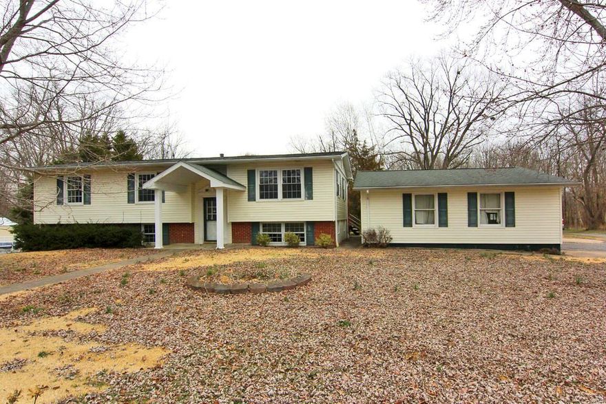 Spacious 4BR / 3BA home situated on corner lot. Offers walk out & detached 2 car garage. New flooring and paint throughout. Main level features 3 bedrooms & 2 bathrooms, formal dining, and living room. Lower level boasts a bedroom, full bathroom, and TWO separate family rooms.