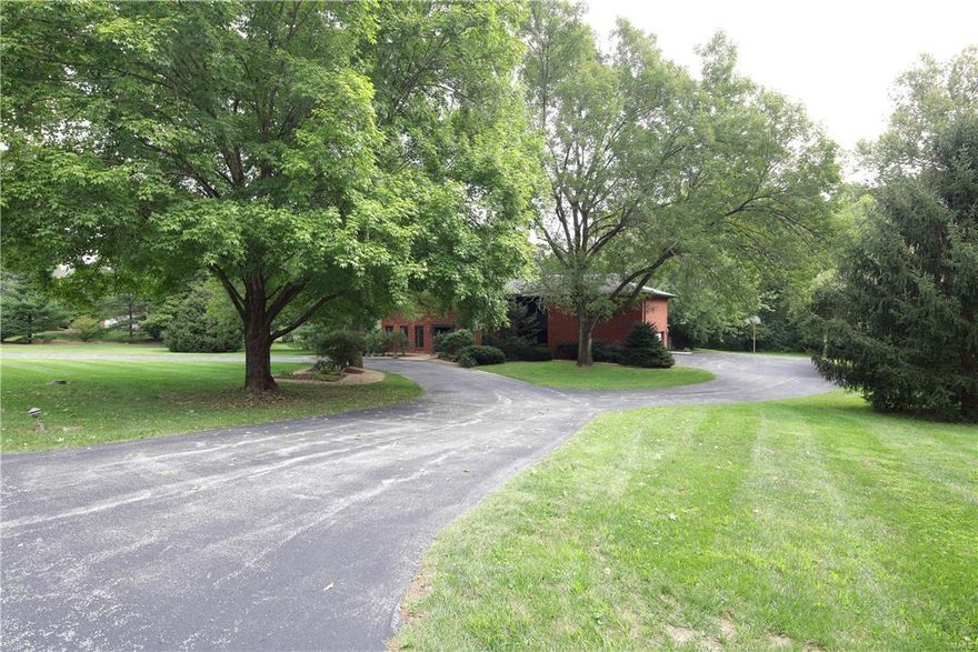 GREAT NEW PRICE!  $70,000 OFF ORIGINAL. Beautiful 3-acre property on Somerset Downs.  This is an ideal Ladue building site in one of the area's most desirable locations.  There is a 4,200 sq. ft. six bedroom home with a pool.  Property is being sold in "as-is" condition.  A portion of the property is in the flood plain.  The improvements are not affected.