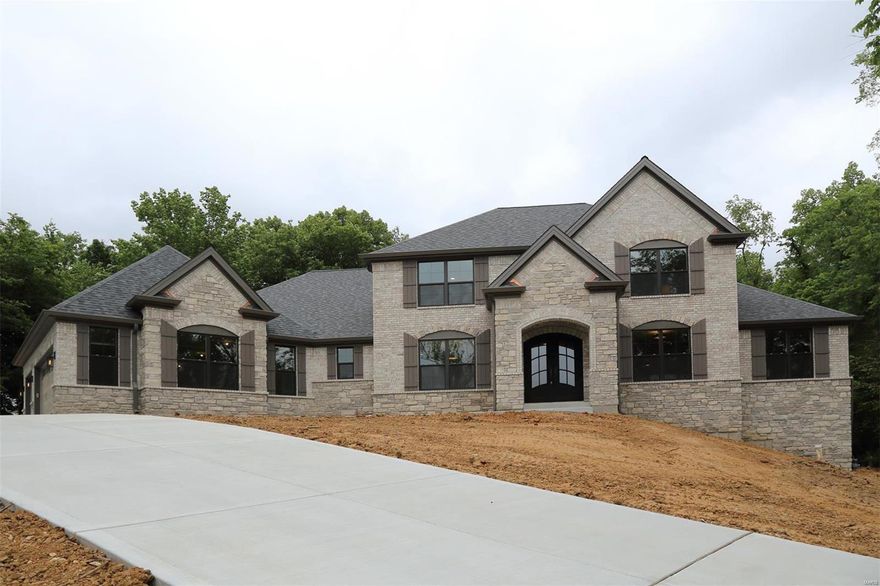 New 4,109 sq ft 1.5 Story Inventory Home by JS Clement Construction. Beautiful 1.135 acre lot on a private cul-de-sac lane in the heart Des Peres. Exceptional quality w/impressive high end features & finishes. Brick/Stone front elevation. Pella windows, custom iron entry doors. Formal dining & 1st floor office. 2 story great room with stone fireplace. Extensive crown moldings, 3-1/4" wood window casings, 5-1/4" base moldings. Extensive solid hardwood flooring. Quality stainless appliances include gas range with ceiling mount hood, 2nd built-in oven, and drawer microwave. Quality cabinetry w/soft close drawers & doors, under cab lights & solid surface counter tops throughout. Hearth rm w/fireplace exits to a covered patio/outdoor rm. 1st flr master suite has a huge luxurious bath w/custom tile finishes. 3 large bdrms & a huge bonus rm on 2nd floor. Deep pour walk-out LL w/rough-in for bath & bar. High eff zoned HVAC. Outstanding location. Don't Delay! COOL: 14 SEER+