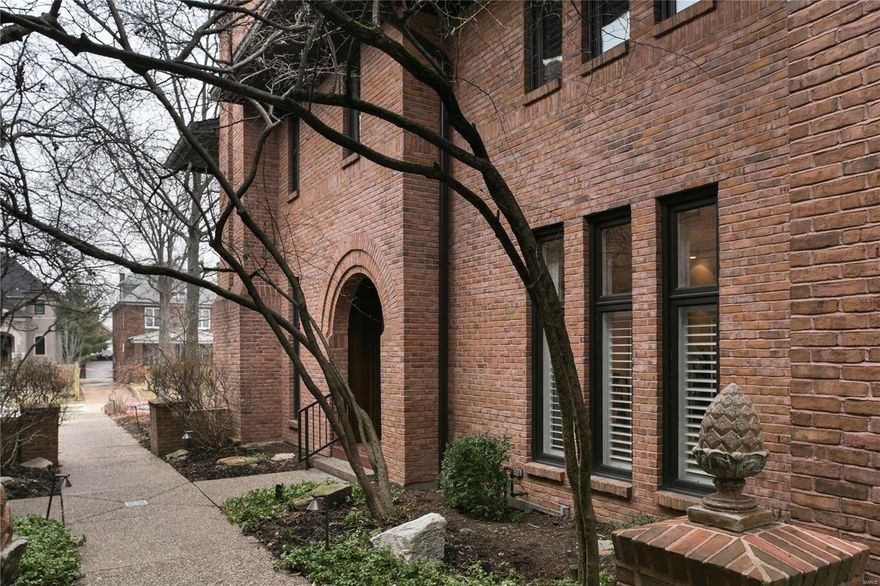 Luxury living in the heart of Old Town Clayton!  This elegant townhome w/ an elevator to all levels is beautifully appointed with rich moldings, high ceilings, 2 gas fireplaces, gleaming hardwood floors and lovely floor to ceiling windows w/ custom draperies and plantation shutters.  The sophisticated living room opens to the dining room, cozy den and wonderful, private terrace with a fountain and stack stone walled beds.  The kitchen and breakfast room offers custom cabinetry, high end appliances including a Subzero refrigerator, Thermador gas cooktop, warming drawer & convection microwave, & Bosch dishwasher.  Upstairs you will find the spacious master bedroom  & luxurious bath with an oversized white marble tile, walk-in shower, heated floors & towel rack, custom cabinetry & private toilet area.  Two additional bedrooms and a bath offer plenty of room for a home office or overnight guests.  2nd floor laundry.  Oversized 2 car assigned parking & storage in the secure, heated garage. Location: Suburban