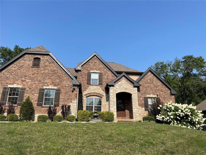 The perfect blend of sophistication and relaxed style makes this 6-year home a standout. The home features 5 bedrooms, 4 full & 2 half baths, over 3,500 square feet of living space and a light-filled, flexible floorplan. Hand scraped hardwood floors, 9-foot+ ceilings and stunning curved wall construction are just a few of the gorgeous details. The spacious yet inviting living room features a vaulted ceiling and see-through gas fireplace with stone surround. The eat-in kitchen boasts top of the line stainless appliances and flows seamlessly to butlers pantry, breakfast room and hearth room. The main floor master is a sanctuary, with a large walk-through closet & luxurious master bath. A second main level bedroom suite can also be an ideal home office. Upstairs, three ensuite bedrooms join the large family/media room. A lower level rec room, ample unfinished space and 3 car garage complete this offering in the Ladue School District, just minutes from Ladue shops, restaurants & highways. Additional Rooms: Mud Room