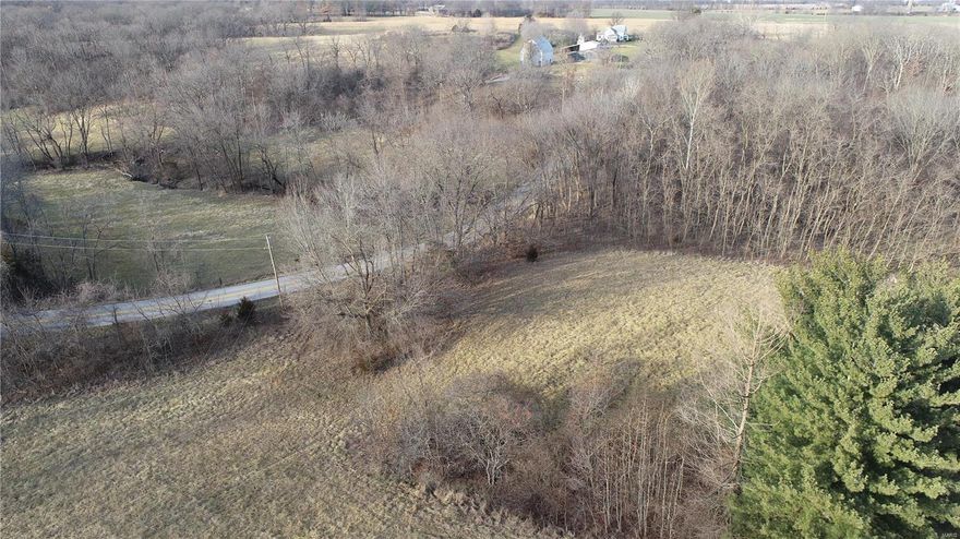 Looking for a great secluded 7.5 acres with easy access to the highway? You've found it! Enjoy your drive on a smooth, asphalt road to your secluded oasis. With beautiful wooded scenery and plenty of open space to build, this is the perfect location for your new, custom home. Call today to schedule your showing!