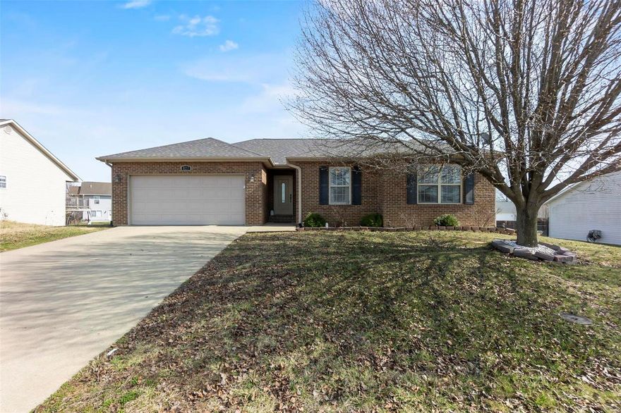 This beautiful, move-in ready home is located in a wonderful neighborhood. The open concept main floor features vaulted ceilings, a master en-suite, and two other bedrooms. The washer and dryer are also conveniently situated on the main level. Step through the sliding glass doors onto the deck, which overlooks the fenced-in back yard.

But wait, there's more! The lower level of this home is even better. You'll instantly fall in love with the large family room, complete with a unique custom-built wet bar, perfect for entertaining! There's also a convenient half-bath downstairs, and plenty of storage in the John Deere room.

Come check out your future home...it's a must-see!