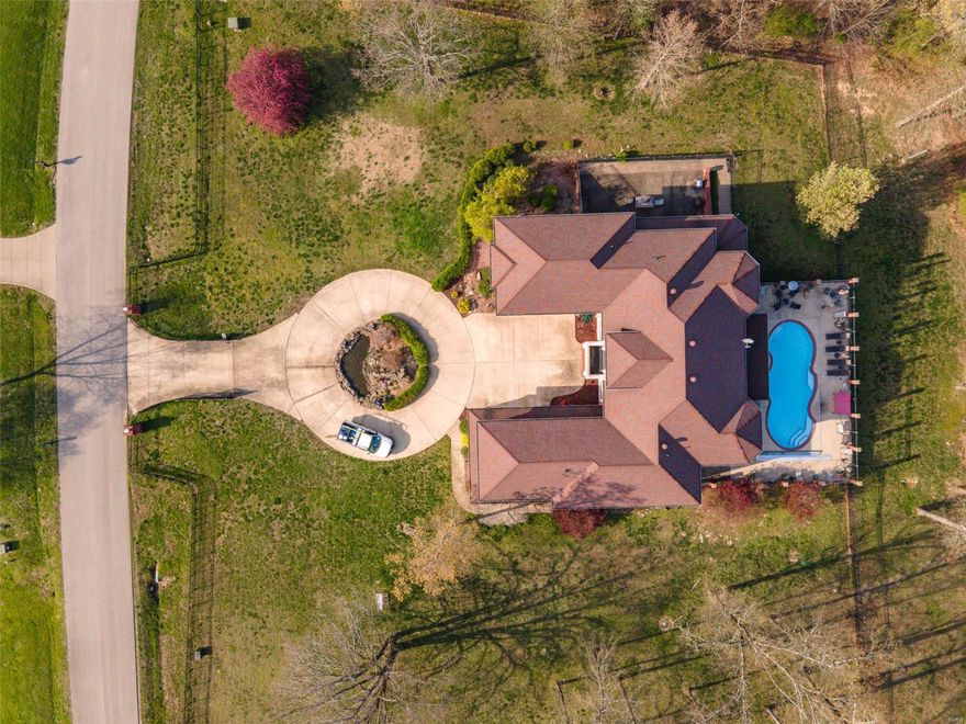 $995,000 6766 Heritage. Mediterranean Villa style all brick 6BR, 5.5BA, 9,900 sq. ft. home with 3 acres m/l in WestBluff Estates. Suspended matching staircases greet you upon entry & the wow factor continues throughout. Kitchen has custom cabinets, center island with second sink, ice maker, double ovens, stainless appliances & a formal dining room!! 2 Lg Masters, 1 master has 1,500 sq. ft. with wetbar & fridge, dual sinks, two walk-in closets, marble floors & marble walk-in shower! Super high-tech built in automated sound system & Leutron lighting, full kitchen in basement with stainless appliances. All fixtures/fans very high end. In-ground pool w/elec auto cover, outdoor kichen, large patio area perfect for entertaining!! Property is fenced in and has a fenced courtyard area! Geo-thermal HVAC, 2-2 car att. garages!! Washer & dryer hookups both on main level & uper level, 4 electric fireplaces, tray ceilings, wet bars and more!!! Driveway has an electric gate as well!!