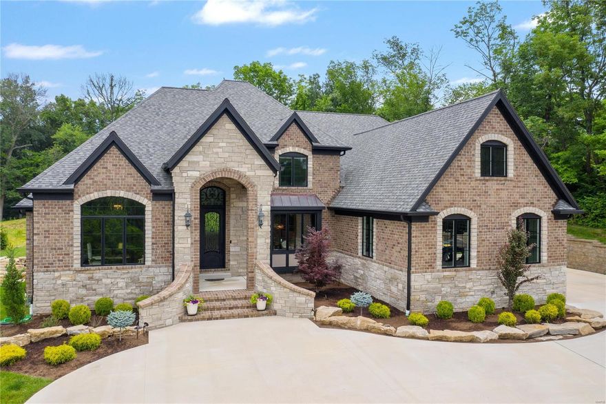 Built in 2018, backs to Queeny Park and at the end of the cul de sac. High quality craftsmanship, the latest green building techniques and exceptional design are staples of this Award Winning Builder. Inside you'll find exquisite millwork throughout - box beams, extensive crown molding, paneling, built-ins, arched openings and custom curved staircase. STUNNING CHEF'S KITCHEN equipped with custom painted white cabinets w/ full extension drawers, soft close doors and layered crown molding. Perimeter quartz countertops & marble backsplash, Thermador professional appliances and concealed exhaust hood featuring cabinet front overlays, 10' center stone island w/ cast iron apron sink. Romantic main floor master features 2 walk-in closets & luxurious bath. 2nd Floor includes raised media rm w/ coffered ceiling, 3 spacious BR's-each w/ bath & custom closets. Finished basement with 2nd kitchen and 5th bedroom provides over 2000 additional sqft. Covered patio and private yard - great for a pool! Additional Rooms: Mud Room COOL: 14 SEER+