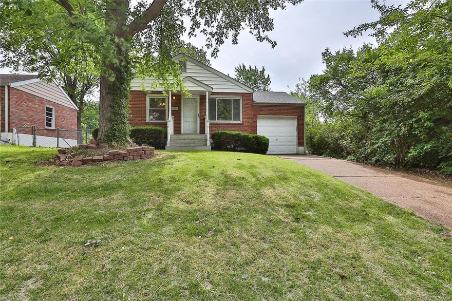 Wonderful 2 bedroom, 1 bath, ranch home with over 1500 sq ft of living space offers balance between original character and modern day conveniences. Original character retained through wood flooring, baseboards, panel doors with original door fixtures, glass block windows & archways. Enjoy updated kitchen, bath & lighting. Predominately brick exterior with covered front porch welcomes you into the living room with a 9 foot openway into the dining room. Updated kitchen offers ample cabinetry with a built in pantry, recessed lighting, deep sink, all appliances as shown & a walkout to the back exterior. Both bedrooms offer extended closets with shelving & a lighted ceiling fan.  Full bath with an adult height designer vanity sink, newer lighting & a shower with tub.  Lower level offers a 33X20 Rec room, with a wet bar, laundry room & a storage room with workbench & built in shelving. Furnace, AC & hot water heater new in 2011. Level fenced in lot & a 1 car garage.