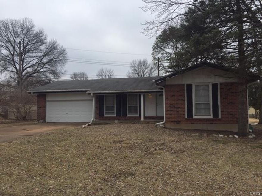 Opportunity is Knocking on the Door!! This 3 Bedroom/2 Bath home is located close to everything and is the Perfect Opportunity to gain instant Equity with some work!  Home has a completely Updated Kitchen with Newer Cabinets, Counters, Custom Backsplash,  etc.... Both Bathrooms have been Updated and are Ready to go, and there are Newer Six Panel Doors throughout and hardwood floors! WOW!  The Large 2 car garage is a huge plus a Huge Level corner lot.  Home needs TLC to the exterior, paint and some clean up in the Basement, but a little work will go a LONG WAY.  The home is being sold "As Is" without any guarantee or warranty by seller, seller to do no inspections or repairs. Home Buyers, Investors, Don't Miss this Opportunity!!!