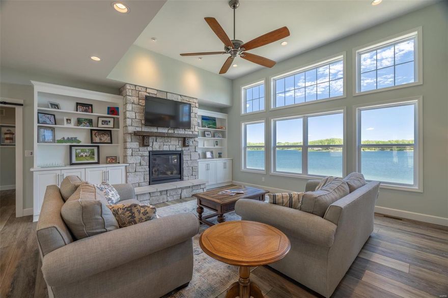 Welcome to your extraordinary lakefront retreat on the shores of Lake Alpine! Stepping inside, the ambiance of modern elegance and laid-back comfort envelops you. The spacious great room seamlessly connects different areas, providing the perfect setting for both intimate family moments and large gatherings with friends. The kitchen has sleek countertops, SS appliances, and ample storage space. The expansive screened porch is perfect for soaking in the serene lake views. 4 bdrms, a bunk room, plus a flex room, allow everyone to have their own sanctuary. The basement is a haven for entertainment, featuring a spacious rec room complete with a shuffleboard table. Outside, a huge stamped concrete patio beckons you to lounge in the sun, while a gentle walk leads you to the water's edge. The expansive sand beach and dock provide easy lake access. Imagine spending starry evenings gathered around the firepit! This furnished home eagerly awaits your arrival for a summer of boundless joy.