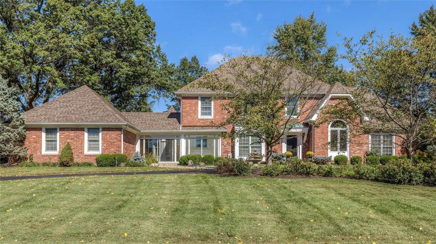 Fabulous brick 1.5 Sty on 1+ acre! Custom-built home distinguished by exceptional quality & craftsmanship throughout! Gracious 2-sty foyer w/framed entryways to paneled library w/built-in bookcases, formal dining room w/extensive millwork & spectacular 2-sty great room w/beamed ceiling, floor-to-ceiling brick fireplace flanked by Palladian windows, wet bar & French doors that open to sunroom. Gourmet kitchen w/cherry cabinetry, granite countertops, center island w/breakfast bar & planning center adjoins octagonal breakfast room w/wall of windows & sunroom that overlooks park like backyard. Main floor MBR w/coffered ceiling, huge walk-in closet & luxury bath w/His & Hers vanities & Jacuzzi offers a private retreat. 3 additional BR's, 1 w/private bath & 2 w/Jack n' Jill bath, + bonus loft area comprise the 2nd flr living quarters. Open staircase to professionally finished LL w/spacious rec room w/wet bar, 5th BR/office & bath. Private cul-de-sac lot with circular drive, patio. Additional Rooms: Mud Room, Sun Room