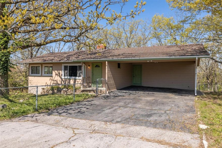 Updated Ranch home on a large lot in a Lake Community.  The main level has 2 Bedrooms (this would be a 4 bed home but 2 rooms don't have closets) plus a Bonus room perfect for an office or at-home school room. Over 1,400 square foot on the main level! Kitchen has solid oak white cabinets. The beautiful Living room with knotty pine paneling has a wood burning fireplace with mantel and full brick surround.  The Master Bedroom offers His and Hers Walk-in Closets and it's own Private Half Bath, The walk-out lower level is partially finished with a Bonus/Sleeping room. The Exterior offers a newer roof and newer windows, Fenced Yard, 2 Car attached car port, Beautiful Painted Exterior, Large Water Feature/ Koi Pond With Water Fall and Bridge with Seating Area. This is a beautiful move in ready home. Come view today before it's to late.