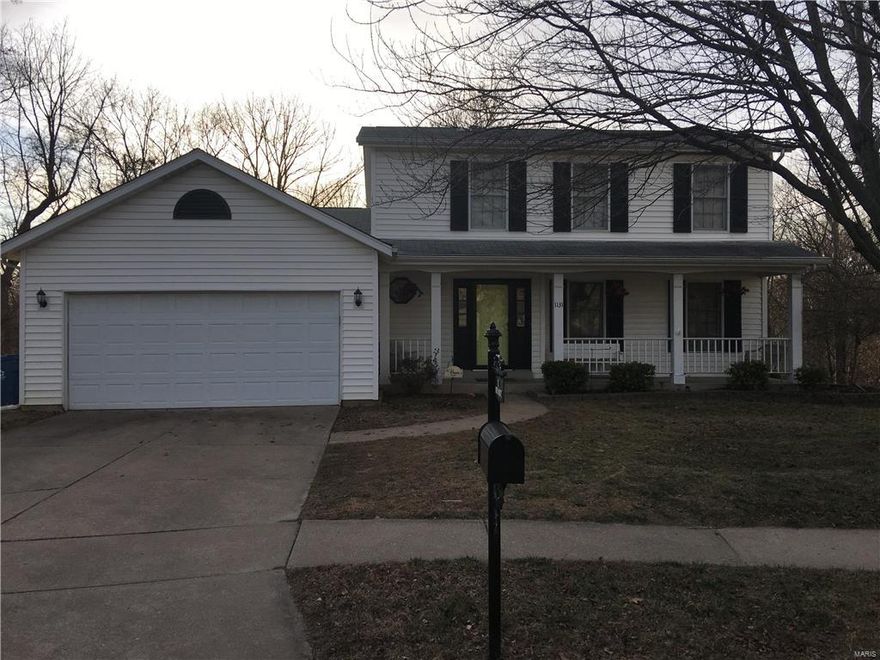 You're going to love this 3 bed, 2.5 bath home in Riverwood Place! Many updates have been made by the current owner, including beautiful laminate flooring that was installed throughout the home within the last year. As you enter the home, there is an entry room foyer with stairs leading to the upper level and a sliding door coat closet. The living room near the kitchen features built-in bookcases on each side of the wood-burning fireplace. The kitchen features granite countertops, with a recently replaced dishwasher, stainless steel gas stove and a pantry. The main level includes a laundry room and separate kitchen / dining areas, as well as 2 family / living room areas. The basement has been finished with drywall and carpet tiles and includes a walk-out plus 2 storage / workshop rooms. The home backs up to the woods, with Harry S Truman Park on the other side of the trees and offers privacy when you are enjoying time on the deck in the summer months. Don't miss this one!