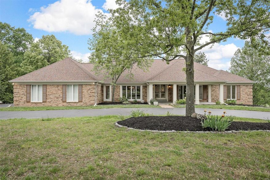 The Open House has been canceled.

 Vaulted ceilings and hand hatcheted timber give the home a warm and inviting feel. Main floor living includes one-of-a-kind hardwood floors, a stone fireplace, stain glass features, and new paint and carpet throughout. The lower level has a second fireplace, a billiard room, and a bar that was built from a 1903 ice cream shop. This home sits on the most beautiful lot with the best view on the most sought-after golf course in West County. When you're not playing golf, you can relax in the infinity pool and spa while enjoying breathtaking views. The landscaping, waterfalls, and lush greenery create the feel of a secluded oasis. Additional features include a copper capped deck, an extra-large 4-car garage, irrigation, and a million-dollar view. All in all, this home is an absolute must-see for anyone who appreciates luxury, comfort, and style. Additional Rooms: Sun Room