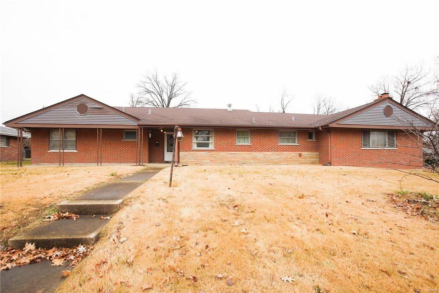 They don’t make homes like this anymore! Solid brick 3 bedroom, 2 bath home with lots of potential. Long asphalt driveway leads to a large 2 car garage providing so many options for parking and storage. Huge front yard complete with steps ascending all the way to the front porch.  Gorgeous hardwood floors throughout most of the home, and so many windows that add a lot of natural light. Laundry conveniently located on the main floor. Dynamic but very versatile floorplan with large kitchen space and a downstairs bonus room with a rustic fireplace. Unique features and lots of character make this home an ideal investment opportunity or chance to create your dream home.