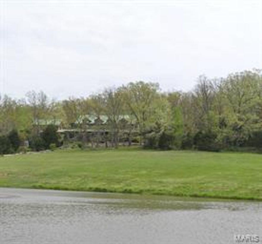 One-Of-A-Kind 136.56 Acre Missouri Wine Country Farm With Unique Log Home!

Breathtaking Southern Appalachian Mountains white pine hand-hewn log home.  Custom designed by the owners, no detail of this stunning 6,500 sq. ft. home was overlooked.  Soaring 28' high ceilings & Rumford stone fireplace draw your eyes upward to the second level with wrap-around balcony.  Interior wood features are from timber from the Mark Twain Forest.  Beautiful floors are 125 year-old recycled wood from the East St. Louis Stockyards.  Truly a chef's kitchen with 2 of several appliances!  Candle-lit formal dining room & the "Back Porch", both of which have a wall of windows.  Second story offers 5 master bedrooms & baths, with 5 bedrooms having FP or wood stove.  Wrap around porch.  Connected to the main home is a 2-story log 'bunk house'.  Acreage is a nice mix of woods & fields.  Stocked lake & pond.  Second Creek runs thru property.  Barn has stalls & tack room.  Numerous horse & ATV trails.