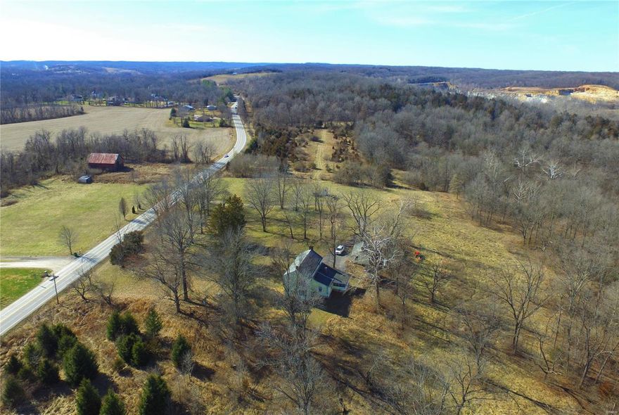 Under the same ownership for over 50 years, this long-time family retreat could now by yours - Located in Missouri Wine Country, it comprises 120.31 acres, more or less, with considerable frontage on Hwy 94 and public water. Bordered on the north and east property lines by Missouri Conservation land. Combination of level to gently rolling pasture, woods, creek, pond and wooded hilltop provide hunting, fishing, hiking, trail riding, observing nature and just plain relaxing. Enchanting old home needs considerable work and is not habitable at this time.  Home and sheds are considered to have little, if any, contributory value overall. Make this your new country estate or family retreat for generations to come. Also enjoy all that the area has to offer such as the 6900+ acre Busch Memorial Conservation area, the KATY Hiking & Biking Trail, award wining wineries, breweries, shops, restaurants, Daniel Boone Home, St. Charles County Park and Missouri River access. Property to be sold "AS-IS".
