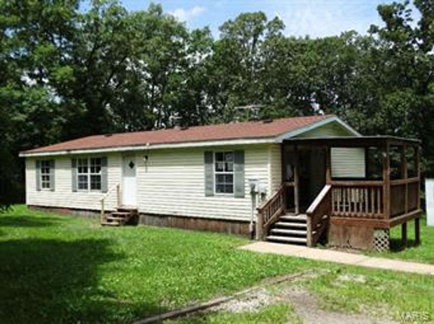 Nice manufactured home sitting on 3.2 wooded acres. 3 bedrooms and 2 full baths. Spacious living room with wood burning fireplace. Kitchen is open with large eat in area and a large window to let in the natural light. Kitchen opens out onto the covered deck. Master bedroom has a full bath and walk in closet. 1144 square feet-information of gross living area above grade is from
the FHA Appraisal and is deemed reliable but not guaranteed SpecialListingConditions: Foreclosure