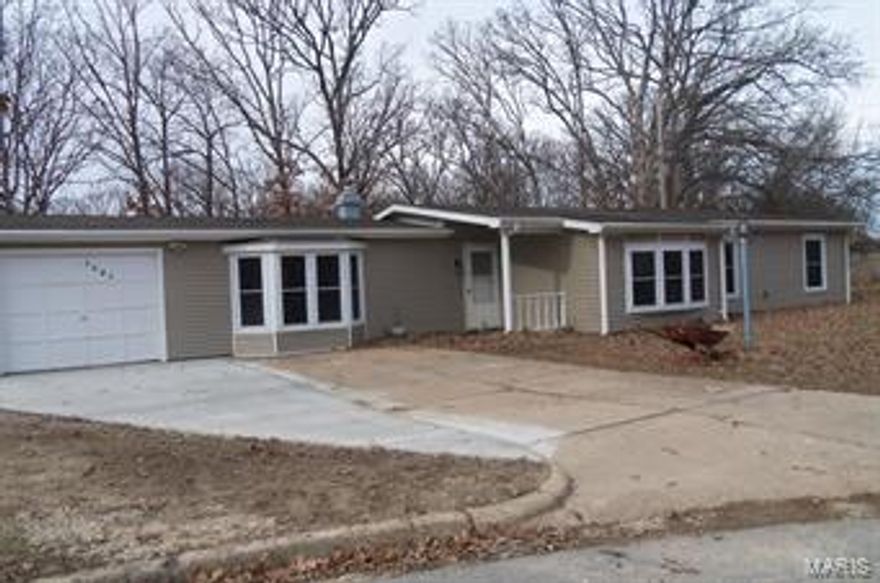 Several updates: newer siding, windows, kitchen with some  stainless appliance, some newer floor.   Woodburning fireplace to help heat the home.  Lovely kitchen with plenty of countertops. Large family room has a bay window.   Seller offering a one year Home Warranty   Family room has a base board heater and window a/c.