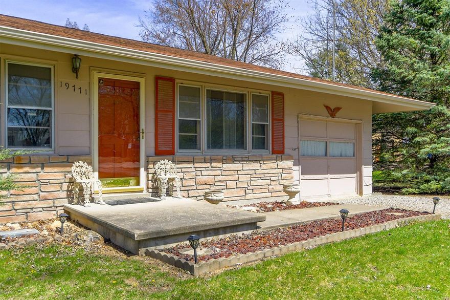 UPDATE: NEW GARAGE DOOR!  Welcome to this charming well-kept ranch style 2 Bedroom home nestled on a corner lot on nearly 2 acres of beautiful yard. This property offers the perfect blend of country living and the convenience of being close to town. This property also boasts a large 30'x24' Morton building as well as a small garden shed.  Enjoy the extra sq footage in the partially finished walkout basement with a large family area, space for an office or bedroom and get cozy next to the wood stove. Enjoy the peace and serenity of rural living while still being a short jot away from town amenities. Don't miss the opportunity to own your own slice of paradise with endless possibilities.