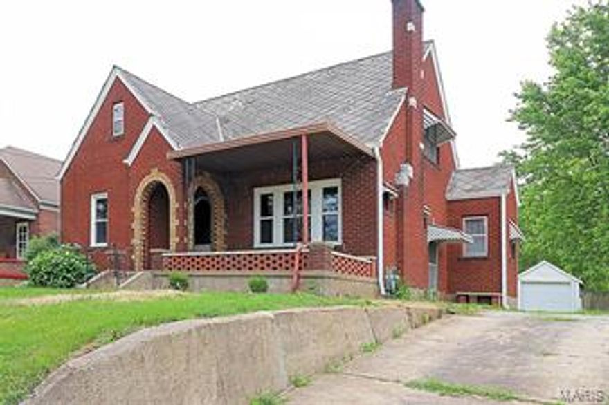 Charming English brick home with arched doorways, covered front porch, long windows, gas fireplace and original wood floors. The floors are recently refinished, some replacement windows, new gutters, interior paint and updated bath on main level.  The second floor would be a great master suite with separate space to relax and watch TV or have an office, bedroom, and new bath. Step through the dining room doors to the outside deck for a nice entertaining area and shaded back yard.