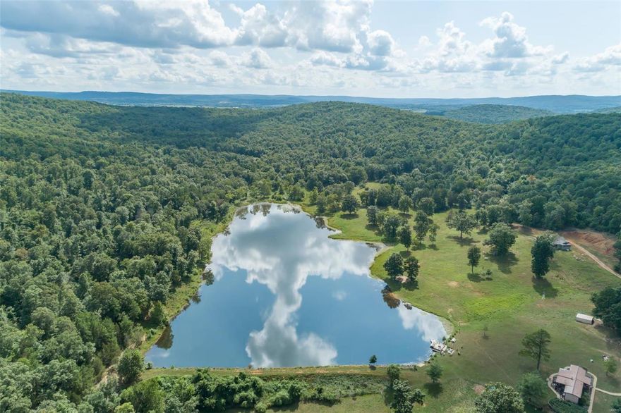 460 acres of natures finest featuring a 12 acre tree lined lake, pastures, woods, all set in the most beautiful valley, just an hour or so south of St. Louis Missouri. This is that once in a lifetime chance to get your very own paradise in a very affordable price range. Backing up to the beautiful Buford Mountain Conservation Area, making this an outdoor enthusiasts dream come true. Perfect for hiking, trail rides for both ATV’s or Equine. Hunters & fishermen behold, what more could you dream of? There is a single wide home on the property and another home that was started but never finished, just waiting for your finishing touches. There are outbuildings and a barn. Currently there are horses, sheep, goats and geese on the property. The current owner with enjoyed many years of serenity in this private oasis and is ready to give someone else the opportunity to make this dream property their own. Call me to make it yours!