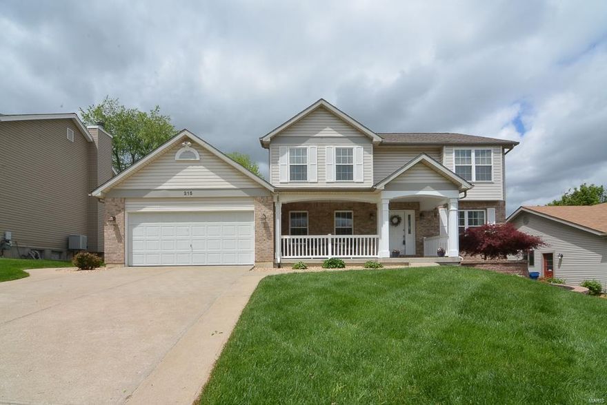 Curb appeal alert! Beautiful landscaping, over sized 2 car garage and covered front porch are just the beginning of this home. Great location minutes from the Page extension. Stunning hardwood floors on the main floor in the formal dining room, living room and family room. Fireplace in the family room can be wood burning or gas. Bay window and ceiling fan in the family room as well. Tile flooring, center island w/ breakfast bar, cambria counter tops, custom backsplash and walk in pantry in the kitchen. Access the spacious deck and patio from the eat in kitchen. Great outdoor space for entertaining. Half bath and huge laundry/mud room on the main floor. Upstairs you'll find 2 guest bedrooms, one w/ a window seat and walk in closet, guest bathroom and master suite. Master suite features vaulted ceilings, walk in closet and ceiling fan. Double sinks, tile flooring and separate shower and tub in the master bath. Unfinished lower level is awaiting your vision for added living space.